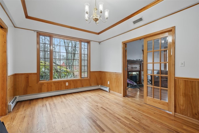 97 Ludlam Rd, Monroe, NY 10950 - spare room with a wainscoted wall, a chandelier, wood finished floors, a baseboard radiator, and wood walls