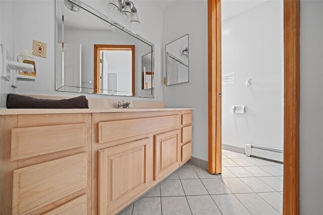 97 Ludlam Rd, Monroe, NY 10950 - bathroom with a baseboard heating unit, vanity, tile patterned flooring, and baseboards