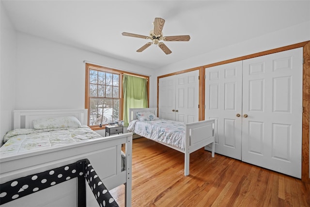 97 Ludlam Rd, Monroe, NY 10950 - bedroom with multiple closets, light wood finished floors, and a ceiling fan