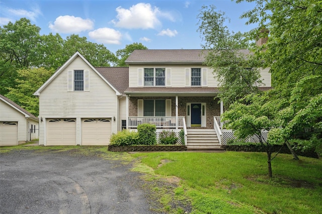 97 Ludlam Rd, Monroe, NY 10950 - view of front of house with covered porch, driveway, a garage, a chimney, and a front lawn