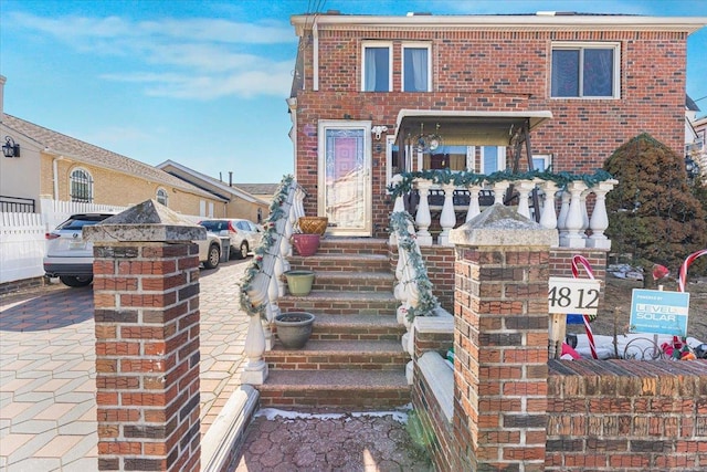 view of front of house with brick siding