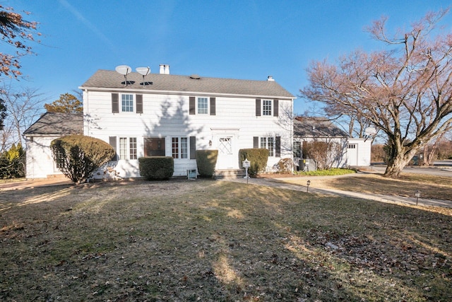 colonial house with entry steps and a front lawn