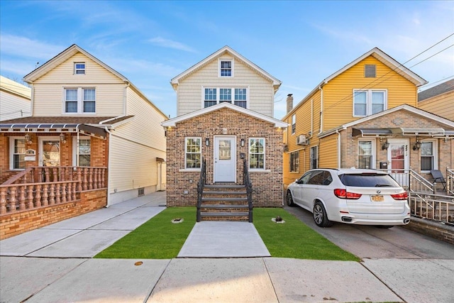 view of front of home featuring brick siding