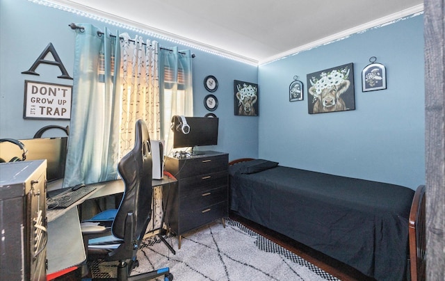 bedroom featuring crown molding