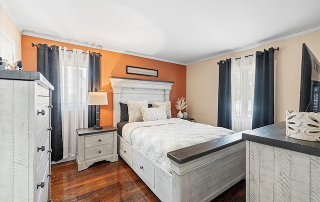 bedroom with multiple windows, dark wood finished floors, and crown molding