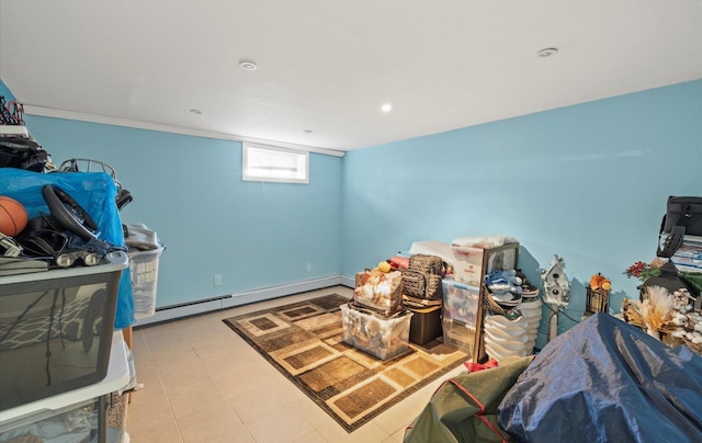 recreation room featuring a baseboard heating unit