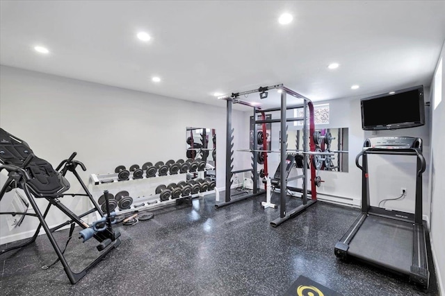 gym with baseboards and recessed lighting