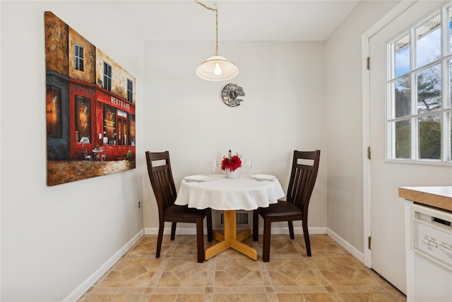 dining area featuring baseboards