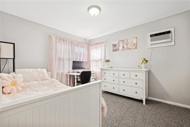 bedroom with carpet, a wall unit AC, and baseboards