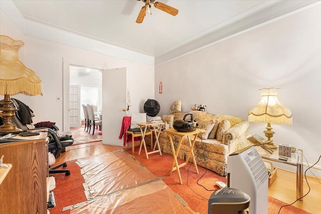 office featuring crown molding, ceiling fan, and wood finished floors