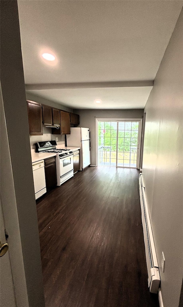 kitchen featuring white appliances, light countertops, dark brown cabinets, baseboard heating, and dark wood finished floors