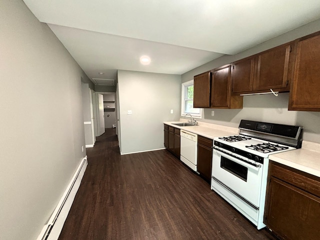 kitchen featuring white appliances, dark wood-style flooring, a sink, light countertops, and baseboard heating