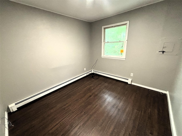 unfurnished room featuring wood finished floors and baseboards