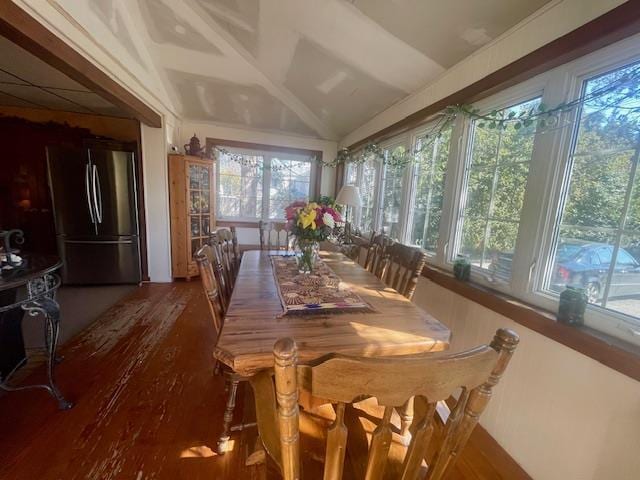 sunroom / solarium with a wealth of natural light and lofted ceiling