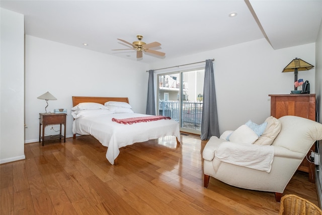 bedroom featuring light wood-type flooring, access to outside, and recessed lighting