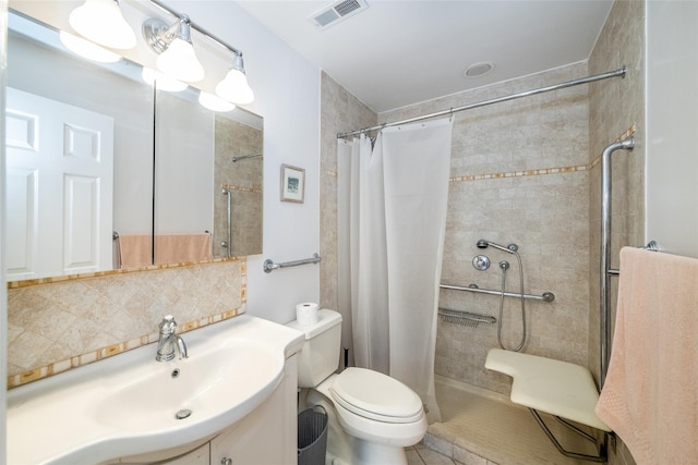 full bathroom with tasteful backsplash, visible vents, toilet, vanity, and tiled shower