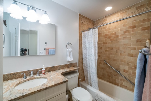 full bath with toilet, shower / bath combination with curtain, and vanity