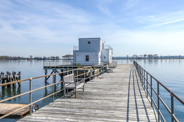 view of dock featuring a pier and a water view