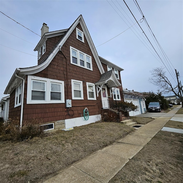 view of front of home featuring a chimney