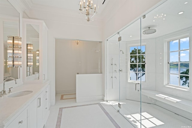 full bathroom with ornamental molding, a stall shower, a chandelier, and vanity