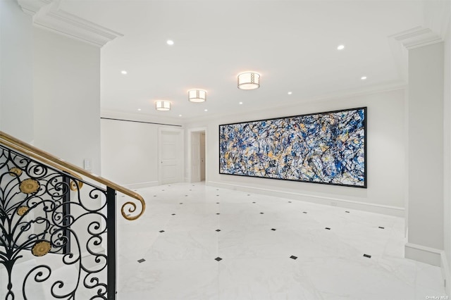 empty room featuring stairway, baseboards, and ornamental molding