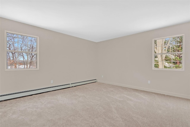 carpeted empty room with baseboards and baseboard heating