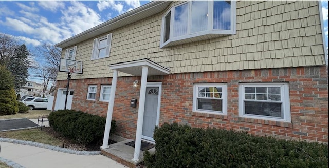 townhome / multi-family property with brick siding
