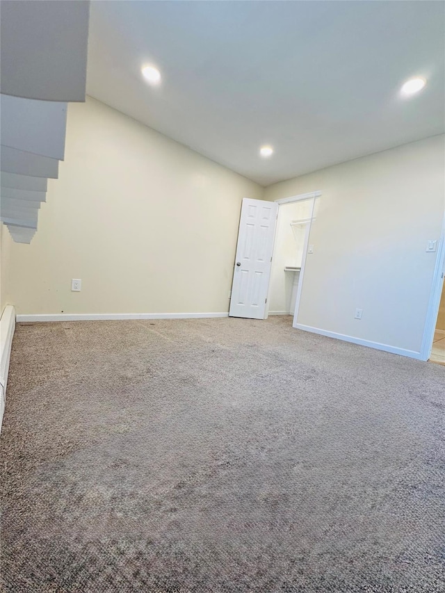 carpeted empty room with baseboards and recessed lighting