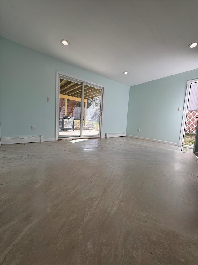 unfurnished room featuring baseboard heating, recessed lighting, and plenty of natural light