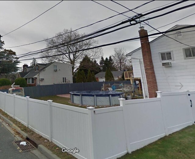 exterior space featuring a fenced in pool and a fenced backyard