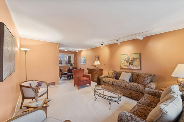 living area featuring light carpet and visible vents