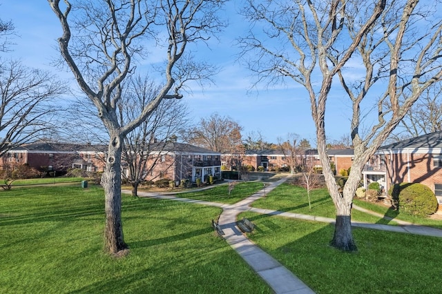 view of home's community with a lawn and a residential view