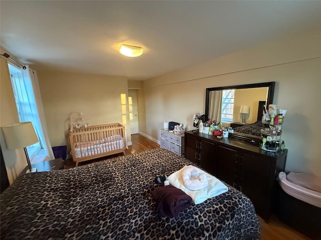 bedroom featuring wood finished floors