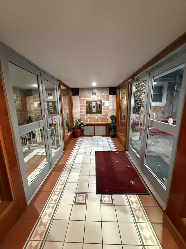 unfurnished sunroom with french doors