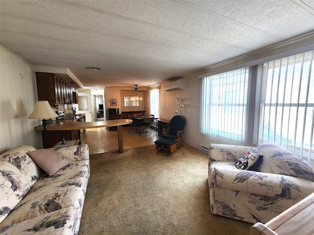 living room with carpet floors, ornamental molding, a textured ceiling, and a wall mounted AC