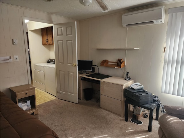 kitchen featuring ceiling fan, a wall unit AC, washing machine and dryer, light carpet, and light countertops