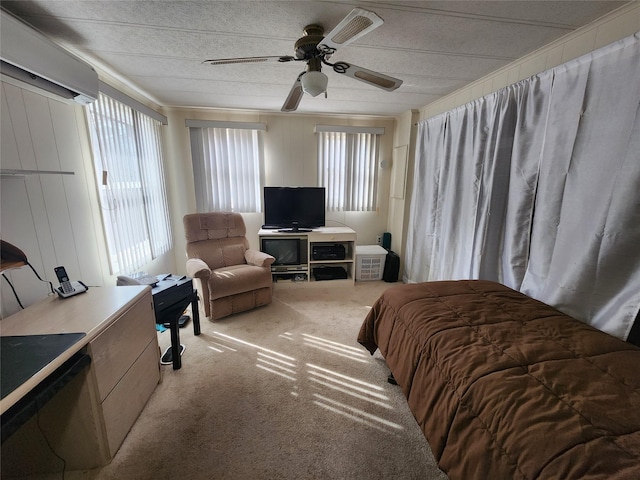 bedroom with a ceiling fan and light colored carpet