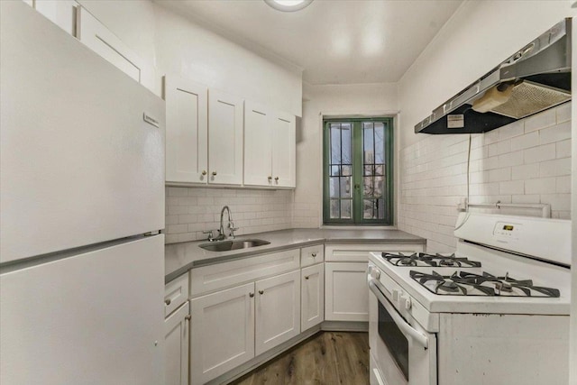 kitchen featuring light countertops, white cabinetry, a sink, ventilation hood, and white appliances