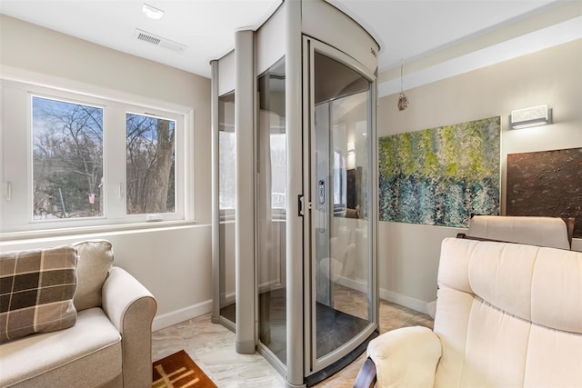 bathroom with baseboards and visible vents