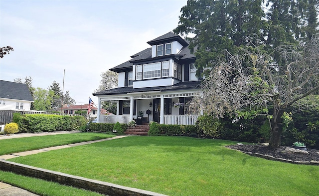 view of front of house featuring a porch and a front lawn