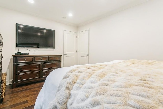 bedroom featuring recessed lighting and dark wood finished floors