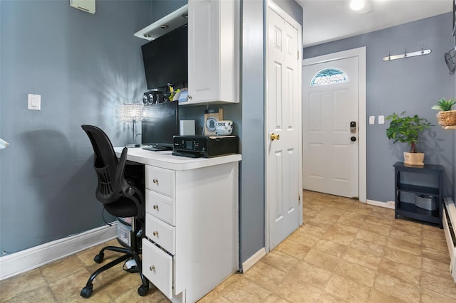 office space with baseboards