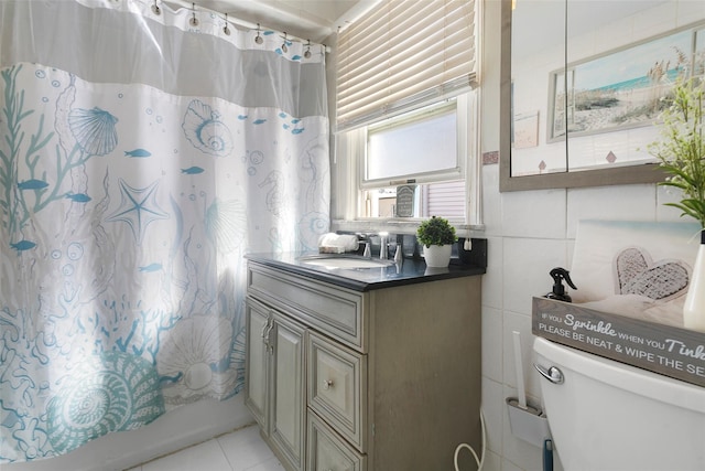 full bath featuring tile walls, toilet, shower / bath combo, vanity, and tile patterned flooring