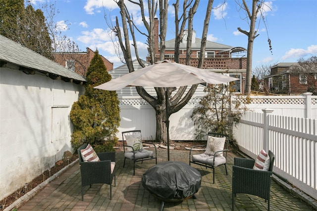 view of patio featuring a fenced backyard, outdoor lounge area, and area for grilling