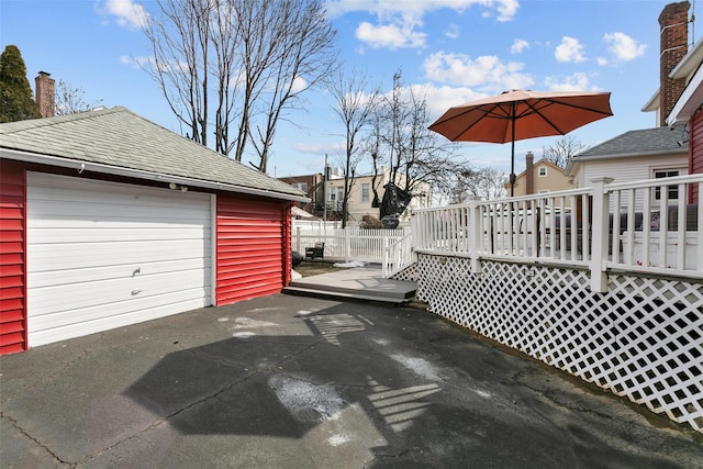 exterior space featuring driveway and fence