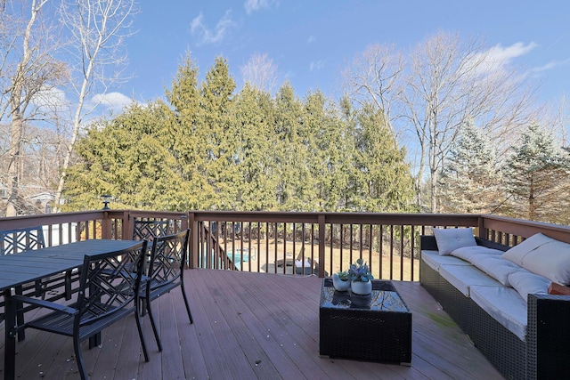 deck with outdoor dining space and an outdoor living space