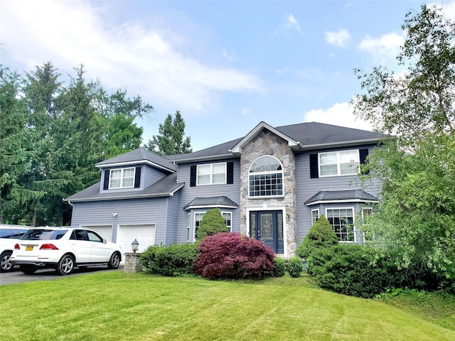 1010 Pine Vw, New Windsor, NY 12553 - view of front of home with a front lawn, stone siding, and an attached garage