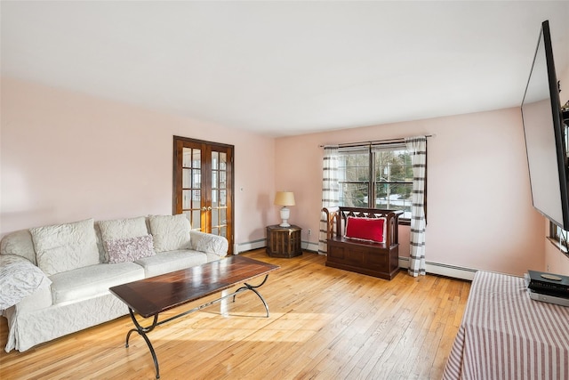 living area featuring light wood-style flooring, a baseboard heating unit, baseboards, french doors, and baseboard heating