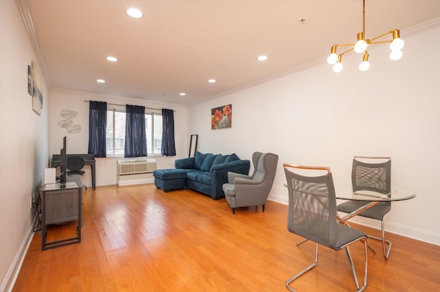 living area featuring light wood-type flooring, crown molding, baseboards, and recessed lighting