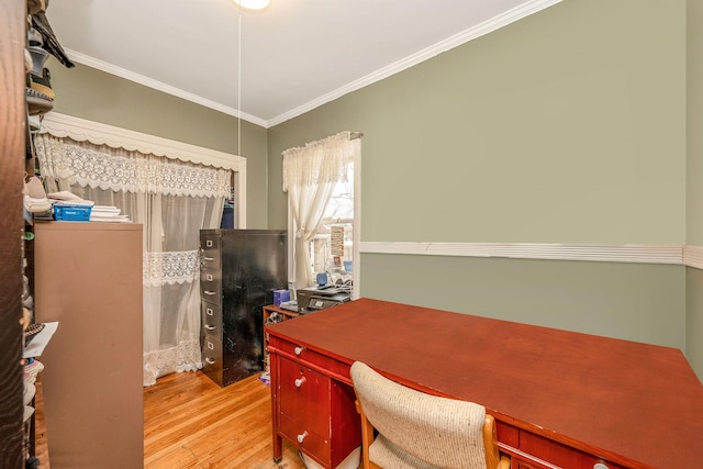 home office with ornamental molding and light wood-style floors